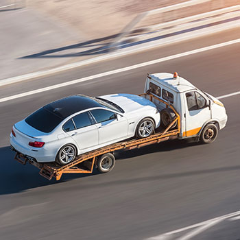 Aaron's Trailers car being towed by trailer